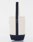 Canvas wine tote bag with navy accents on a white background