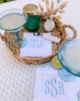 personalized white linen cocktail hour napkins with embroidered initials on tablescape