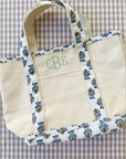 Custom embroidered canvas tote bag with block print trim