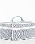 Blue and white striped canvas cosmetic bag on a white background