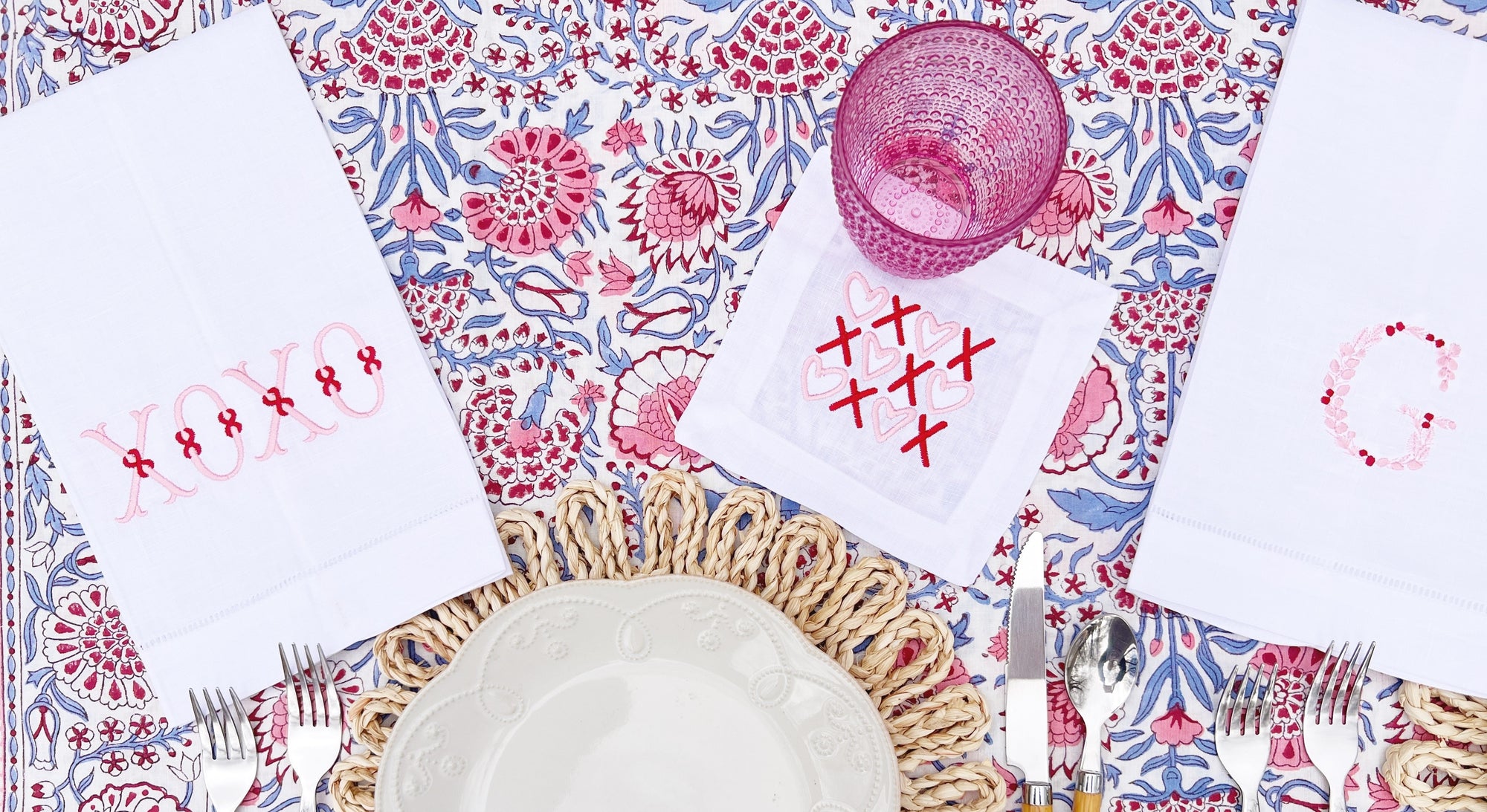Valentine's Day Shop with pink and red embroidered tea towels and linen cocktail napkins