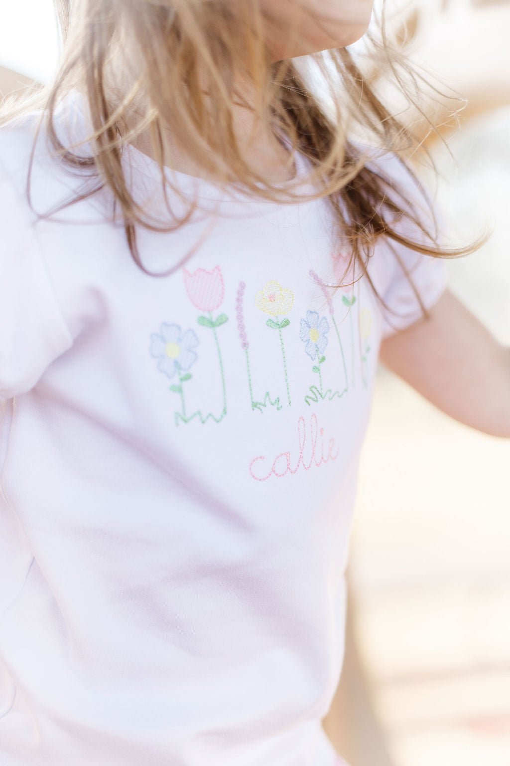 little girl's personalized flower shirt with embroidered name