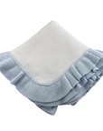 Light blue ruffled baby blanket on a white background