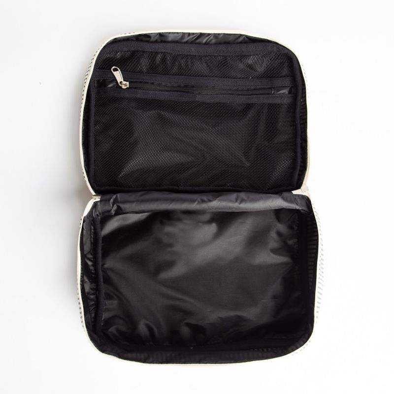 Inside of cosmetic bag with Black satin lining with open compartments on a white background