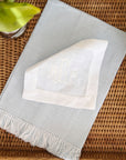 monogrammed white linen cocktail napkins with a light blue fringe hand towel
