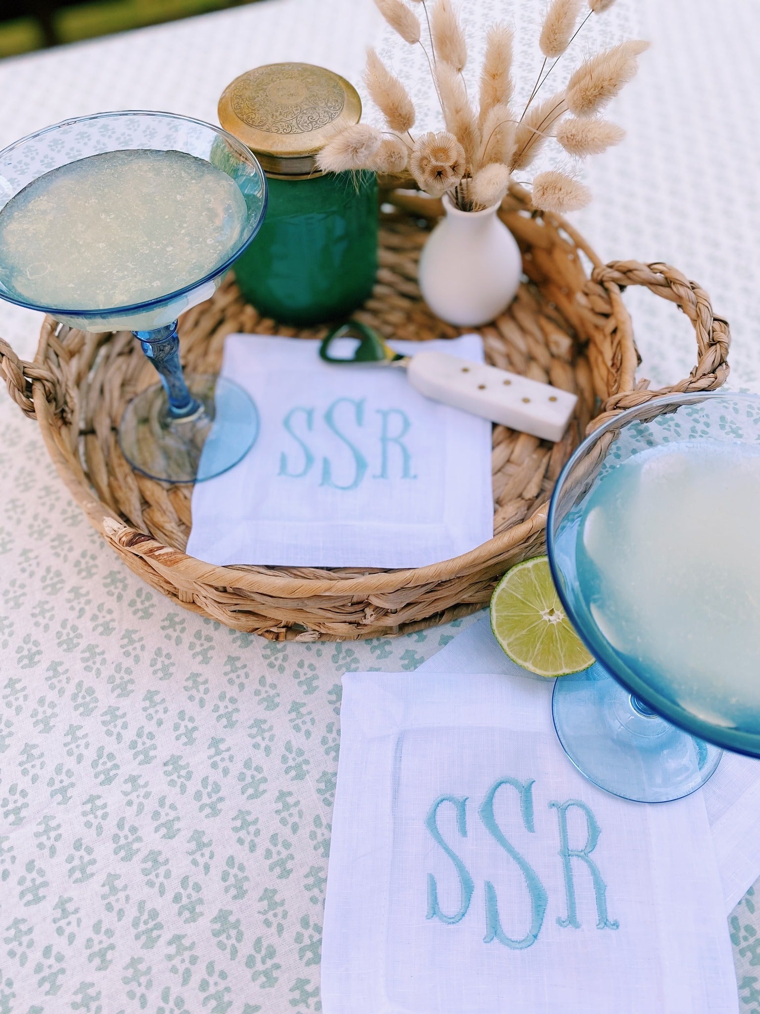 personalized white linen cocktail hour napkins with embroidered initials on tablescape