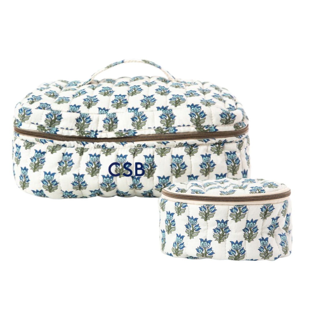 Block Print Floral-patterned fabric cosmetic bags with monogram on a white background
