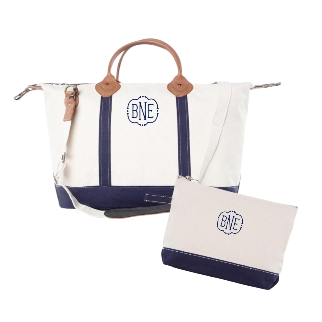 navy and white canvas weekender travel bag with matching zip pouch with embroidered monogram