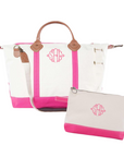 Monogram weekender travel bag with matching zip travel bag on white background
