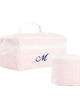 Two pink striped travel organizers with a monogram on a white background