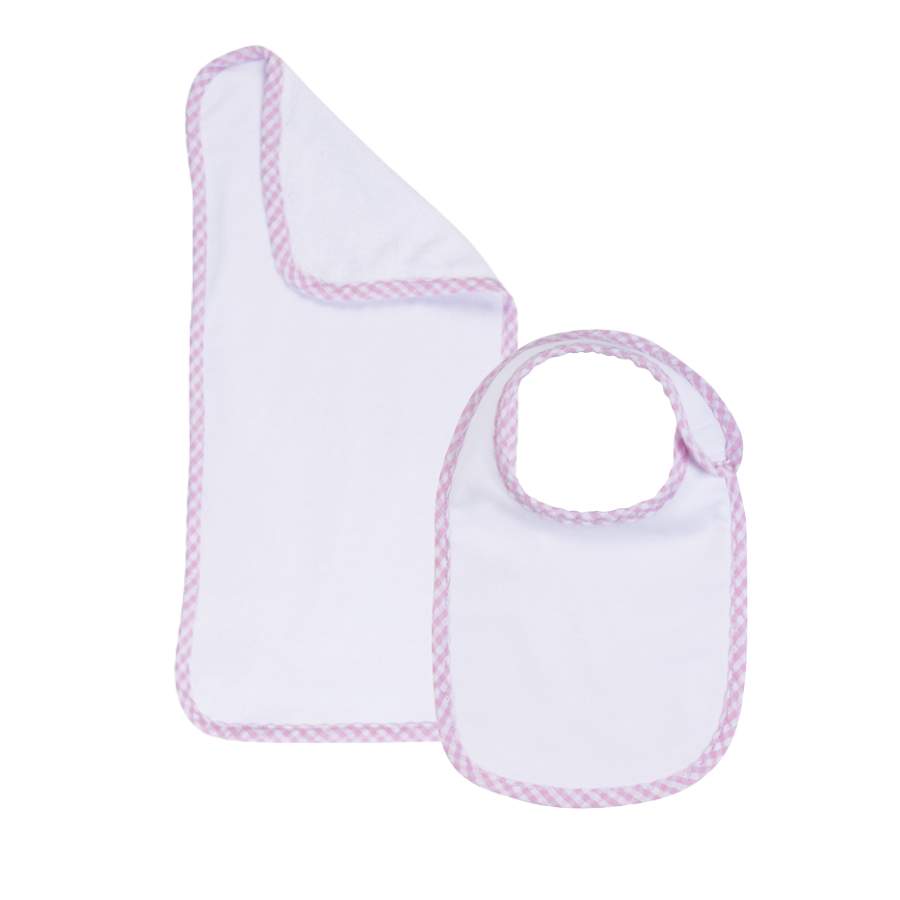 Baby bib and burp cloth set with pink trim on a white background