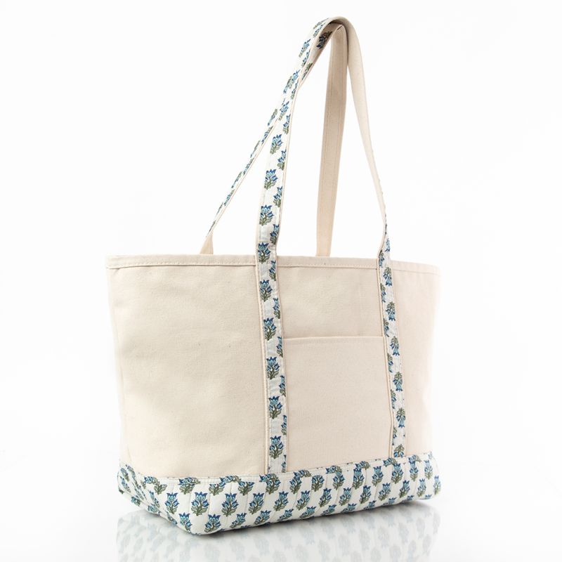 large canvas tote bag with block print patterned handle and bottom edge on a white background