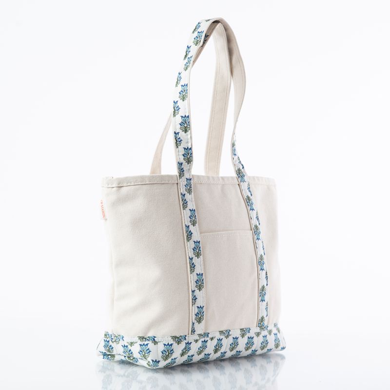 canvas tote bag with block print trim handles and front pocket on white background
