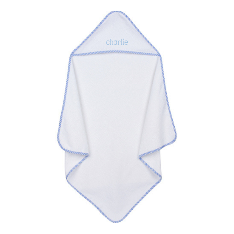 White hooded baby towel with blue trim and embroidered name on a white background