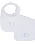 white plain edge bib and burp cloth set with embroidered name on white background