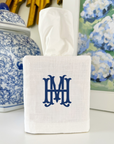 personalized white linen tissue box cover with embroidered initials on a console table